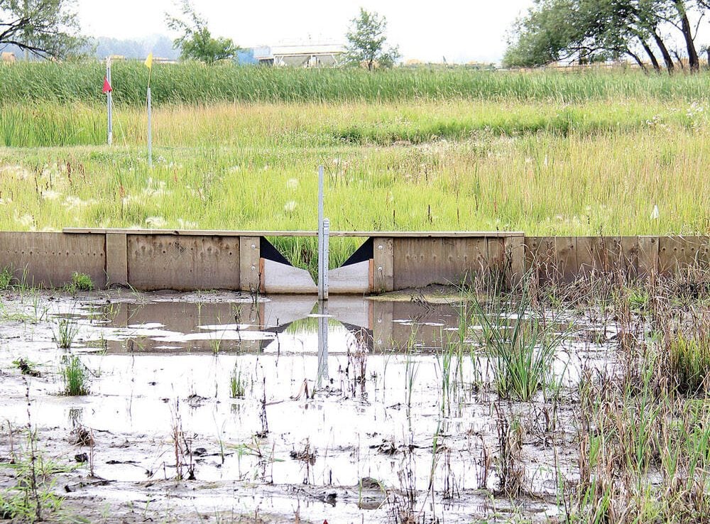 A control structure holds back water at the Morden Agriculture and Agri-Food Canada station in 2016, where a wood chip bioreactor was being tested. Photo: File