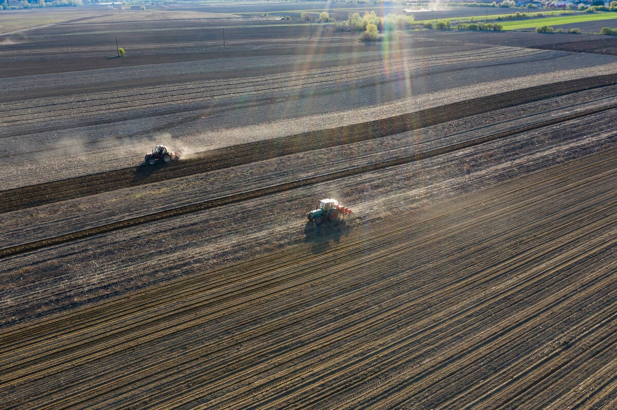 Aerial drone view of tractor working on agriculture spring field. photo:erika8213/stockimages