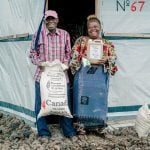 The Canadian Foodgrains Bank works with partner organizations to provide food aid and support farmers in developing countries, such as Congolese chicken farmer Rebecca (pictured &#8211; right), to grow food and support their families and communities. Photo: Canadian Foodgrains Bank/Facebook
