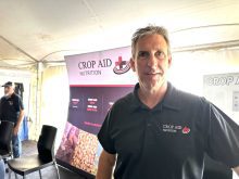 Darren Sander, owner and operations of Crop Aid Nutrion Ltd. at his company's booth at Ag in Motion.