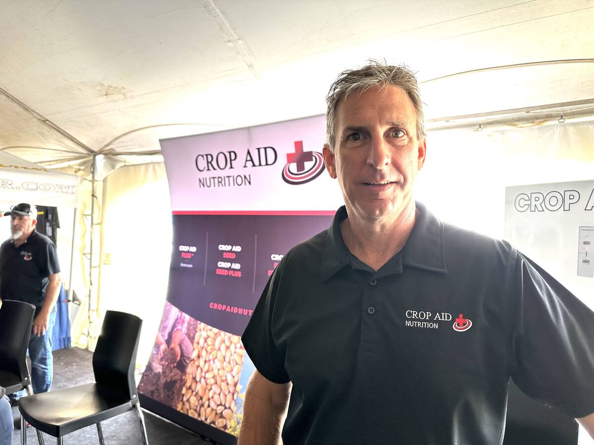 Darren Sander, owner and operations of Crop Aid Nutrion Ltd. at his company's booth at Ag in Motion.