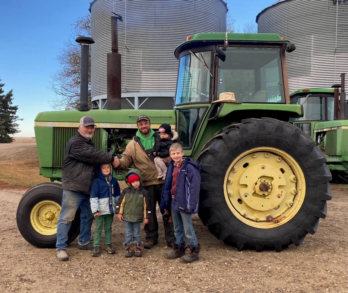 Gregory and Dan shake hands on our purchase of the JD 4430.