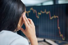 Woman sits observing slight uptick after a significant drop in a commodity or equity on computer screen. Pic: PeopleImages/iStock/Getty Images