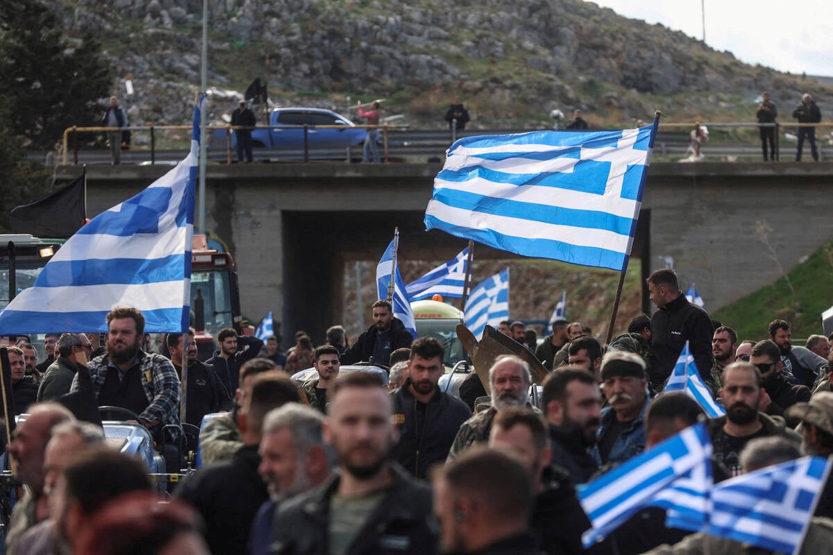 Greek farmers block borders, airport and roads in protest at delayed EU funds