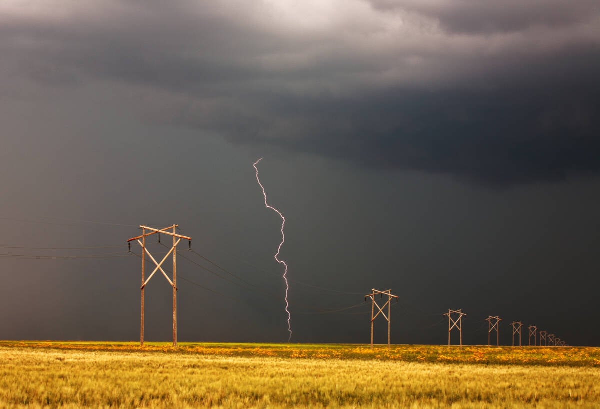 Lightning striking behind Saskatchewan power line. Photo: Bobloblaw/iStock/Getty Images