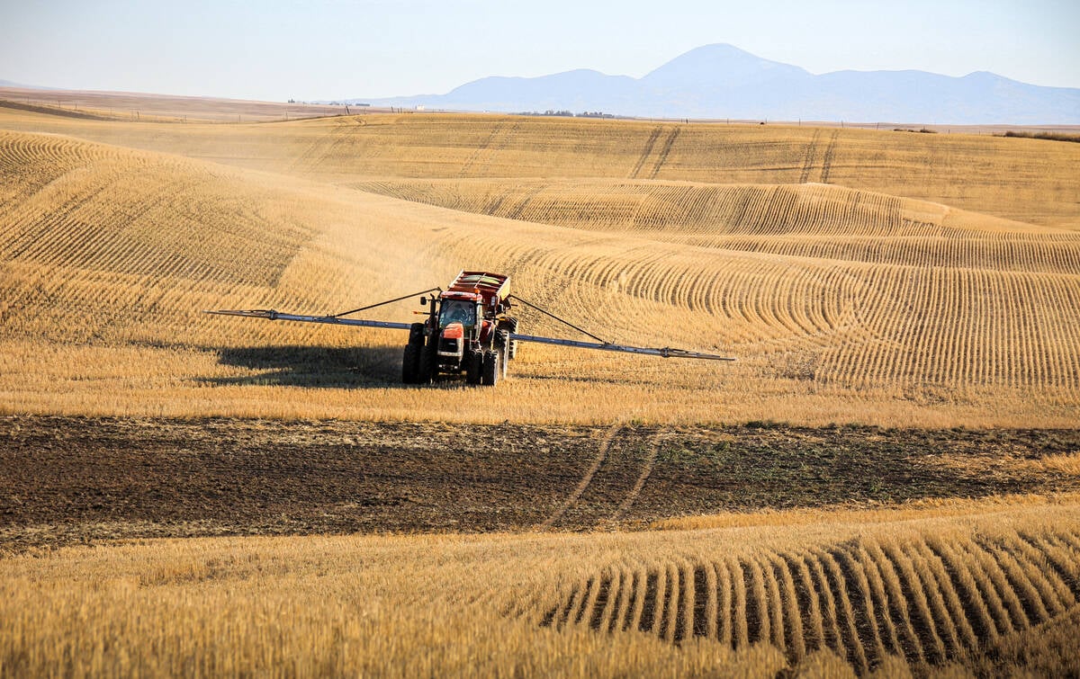 Applying product on a patchy field in the fall. Predictive mapping helps farms focus these applications where weed pressure is historically highest. Photo: Geco
