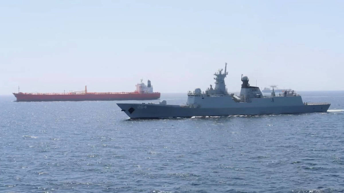 A Pakistan Navy ship escorts a Pakistani merchant vessel, as part of a maritime security operation, named Muhafiz-ul-Bahr, as regional tensions threaten key sea routes, amid the U.S.-Israeli conflict with Iran, at an unidentified location, released March 9, 2026, in this screen grab taken from a handout video. Photo: ISPR/Handout via REUTERS
