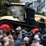 A golden farming tractor featuring the signatures of Trump Administration cabinet members is displayed during an event celebrating farmers and Agriculture Day on the South Lawn of the White House in Washington DC on Friday, March 27, 2026. Photo: Aaron Schwartz/Sipa USA
