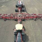 A directly-overhead shot of the one hundred-foot Morris Quantum air seeder with Morris 10 Series 1440 bushel air cart.