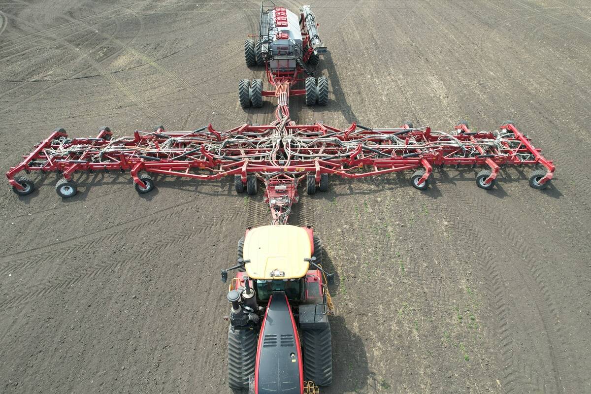 A directly-overhead shot of the one hundred-foot Morris Quantum air seeder with Morris 10 Series 1440 bushel air cart.