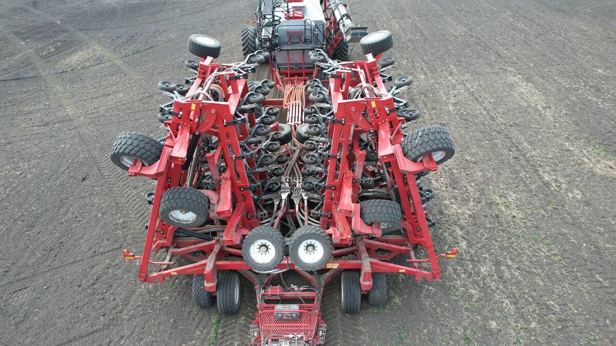 One hundred-foot Morris Quantum air seeder with Morris 10 Series 1440 bushel air cart, folded for transport.