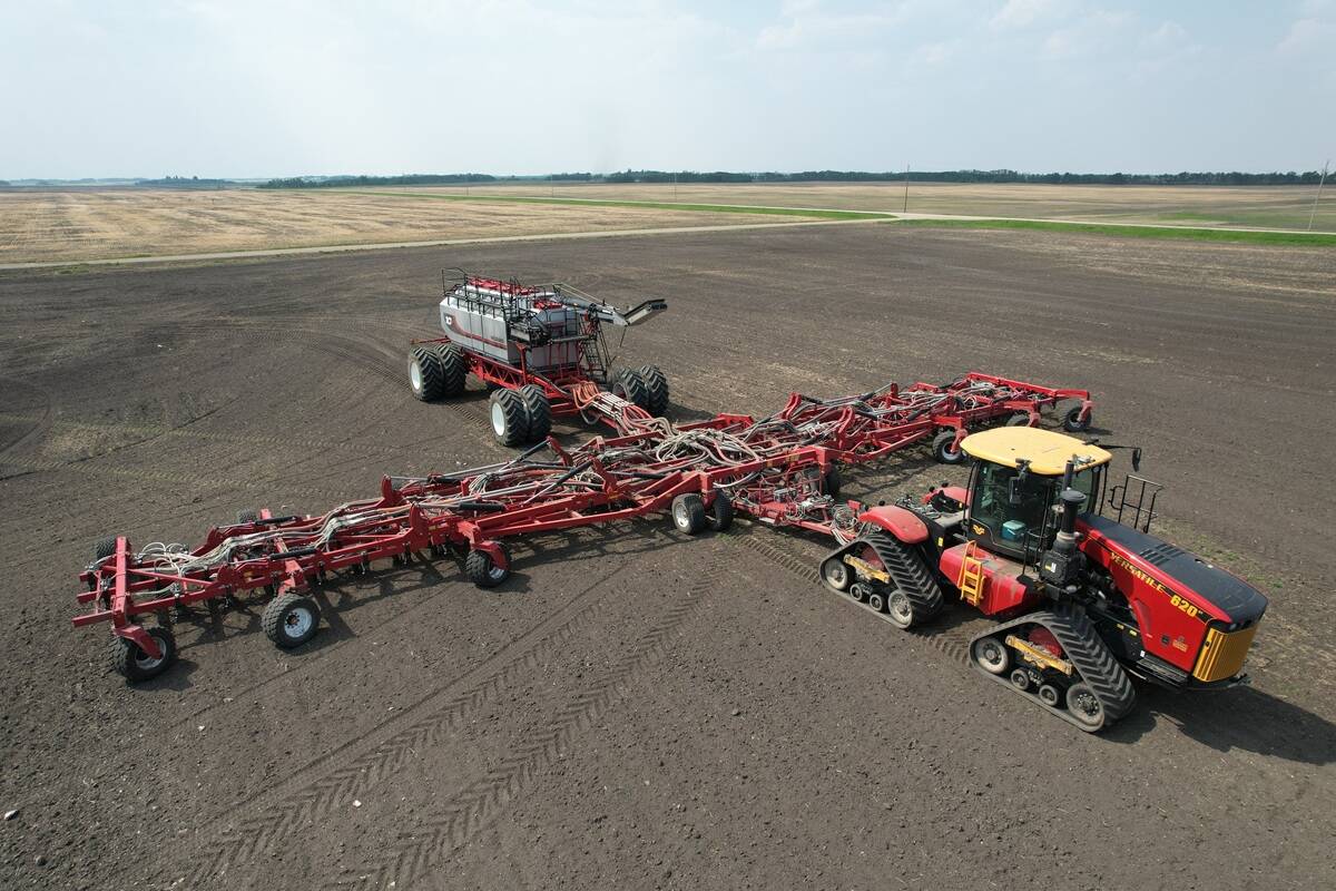 Overhead side view of one hundred-foot Morris Quantum air seeder with Morris 10 Series 1440 bushel air cart.