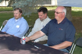 JBS officials, from left, John Ruby, quality assurance; Bill Rupp, president JBS USA; and Willie Van Solkema, president JBS Canada at plant tour and news conference.