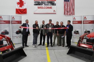 AGCO executives and guests cut the ribbon at the company's new Woodstock parts distribution centre
