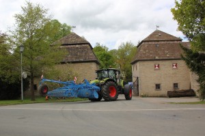 One of Lemken's tillage implements is moved in through the main gate of a 500-year-old farmyard where the Press Day was held