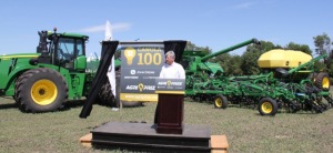 Rob Saik of Agri-Trend Agrology, surrounded by a fleet of John Deere equipment announces the start of the Agri-Prize 100 bushel canola contest.