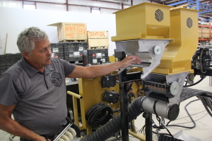 Norbert Beaujot points out the features of the new seed metering system the company intends to introduce for the 2017 season