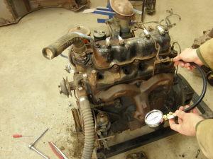 The old engine now turns over and to my surprise has good compression. It's Alive!