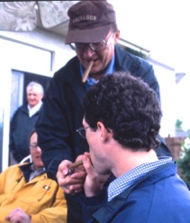 Sirski often wore a ball cap and loved a good cigar. He was also known to lead young people astray. At this work gathering about 20 years ago he is helping one of the Country Guide kids, Jay Whetter, light a cigar.